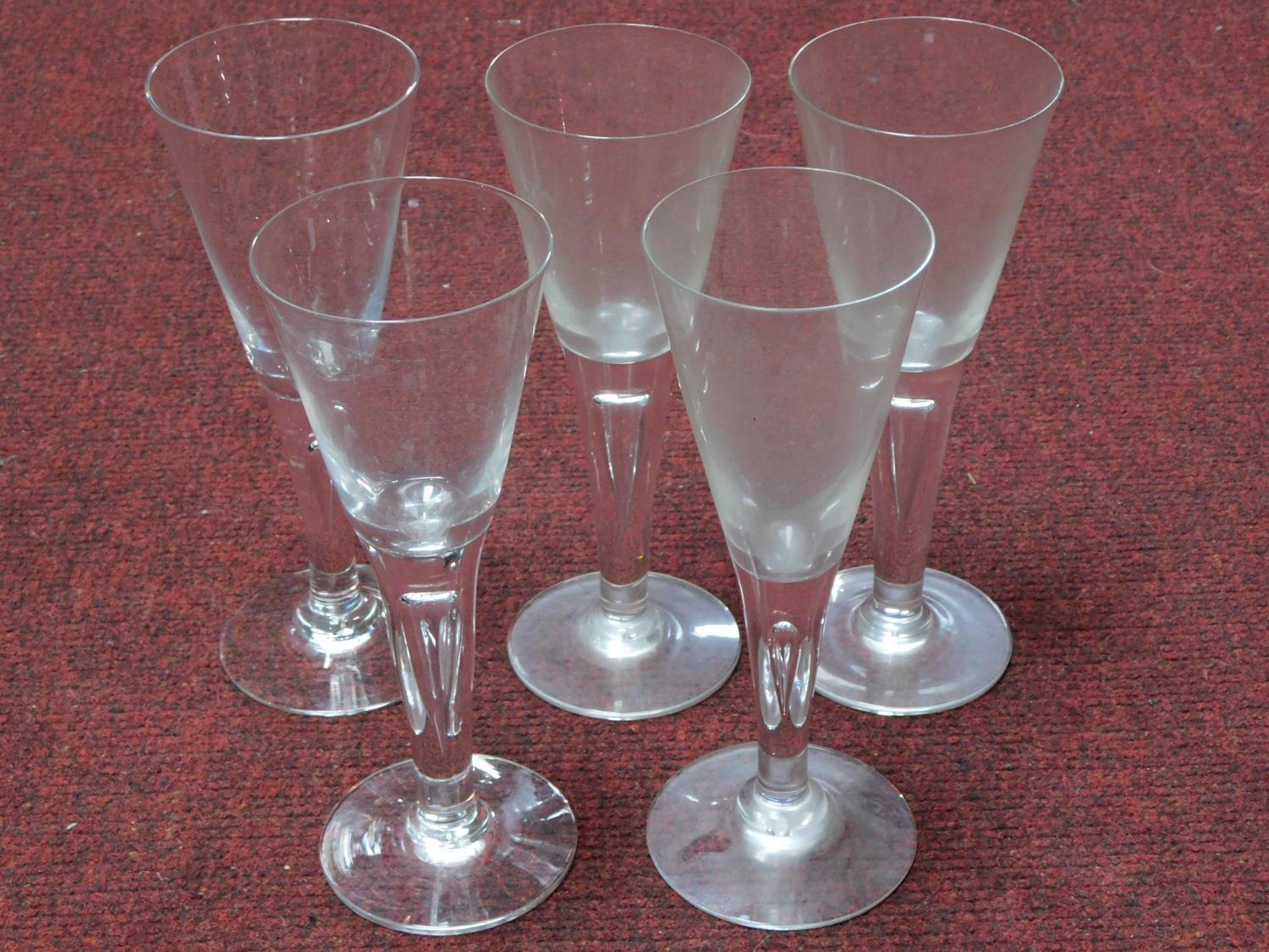 A collection of antique hand blown wine glasses with tear drawn bubble stems. H.22cm