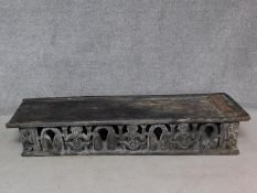 An early 20th century Cameroon carved child's bed. H.33 W.170 D.48cm