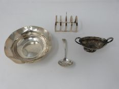 A collection of antique silver including a pierced sugar spoon, a twin handled dragooned salt, a