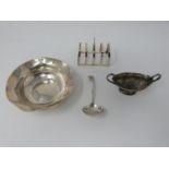 A collection of antique silver including a pierced sugar spoon, a twin handled dragooned salt, a