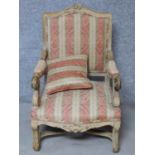 A Louis XV style carved beech fauteuil armchair with matching pillow on cabriole supports. H.105cm