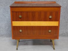 A vintage teak and burr maple chest on dansette supports. H.76 W.74 D.42cm