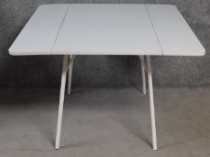 A vintage style metal framed dining table with drop flap formica top. H.74 W.108 D.108cm