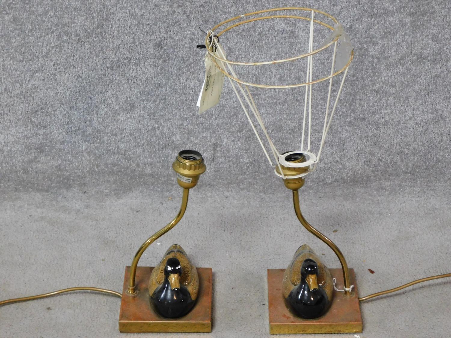 A pair of duck form table lamps retailed by Christopher Wray. H.50cm