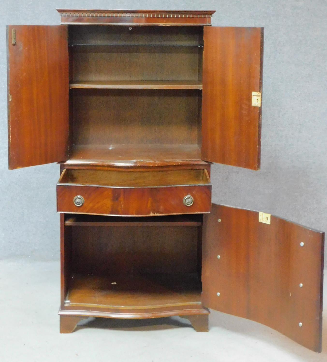 A Georgian style flame mahogany tallboy with panel doors enclosing shelves above drawer and panel - Image 2 of 5