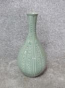 A 20th century Korean celadon glaze ceramic hand painted white flower bottle vase. Lotus petal