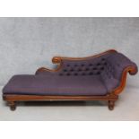 A William IV carved mahogany framed chaise longue in buttoned chequered upholstery on reeded