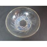 A Lalique opaline moulded glass fruit bowl. With relief fruit and leaf form design on the foot.