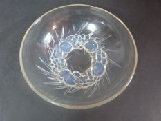 A Lalique opaline moulded glass fruit bowl. With relief fruit and leaf form design on the foot.