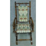 A 19th century American style turned beech child's rocking armchair. H.73cm