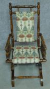 A 19th century American style turned beech child's rocking armchair. H.73cm