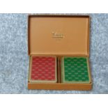 A complete boxed set of vintage Gucci playing cards. Red and and Green gilded Gucci logo design.