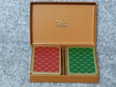 A complete boxed set of vintage Gucci playing cards. Red and and Green gilded Gucci logo design.