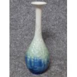 A Chinese crystalline glaze long necked vase with a blue to green to white gradient. H28.5cm.