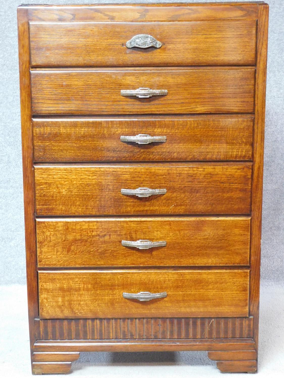 A vintage mid 20th century oak chest of six drawers on bracket feet. H.120 W.75 D.40cm