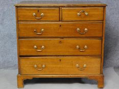 A Georgian oak chest of two short over three long graduating drawers on bracket feet. H.100 W.102