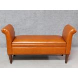 A tan leather Prestbury bench with hinged lid revealing a storage compartment. H.70 W.133 D.45cm