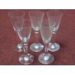 A collection of antique hand blown wine glasses with tear drawn bubble stems. H.22cm