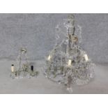 A vintage crystal glass chandelier with cut petal decoration together with a similar lamp. H.62cm