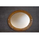 A 19th century gilt framed oval wall mirror. H.80x88cm