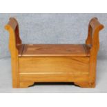 A Continental style hardwood bench with hinged seat revealing storage compartment. H.68 W.97 D.37cm