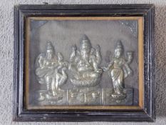 An antique framed and glazed engraved relief picture of Indian deities in white metal. Stamped to