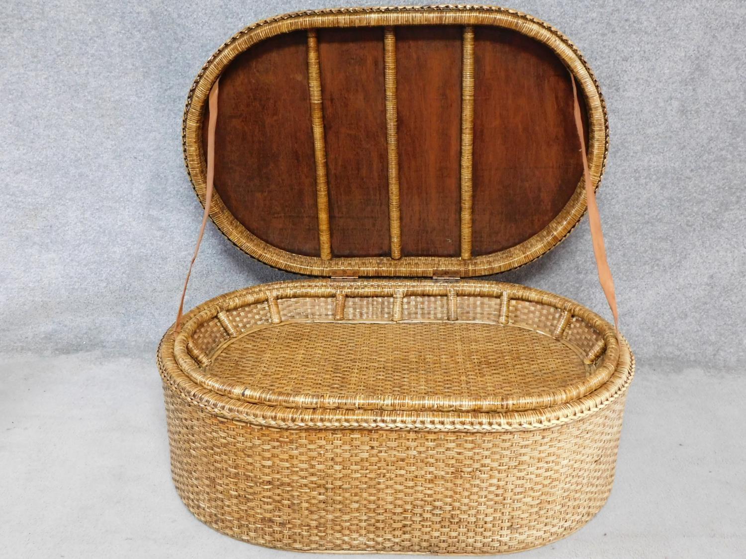 A wicker ottoman fitted with lift out tray by Oka. H.46 W.110 D.72cm - Image 2 of 6