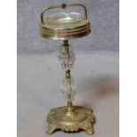 A vintage brass and glass pedestal ashtray. H.53cm