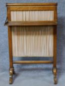 A 19th century bird's eye maple firescreen with folding shelf on cabriole supports. H.88 W.55 D.29cm