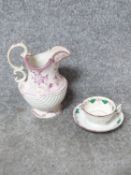 An antique hand painted ceramic lustreware jug along with tea cup and saucer. The jug has a shell