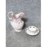 An antique hand painted ceramic lustreware jug along with tea cup and saucer. The jug has a shell