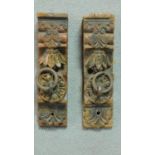 A pair of antique Indian carved and painted door panels with iron rings. H.29 W.8 D.6.5cm