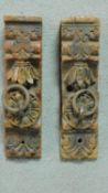 A pair of antique Indian carved and painted door panels with iron rings. H.29 W.8 D.6.5cm