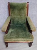 A late Victorian mahogany framed armchair in sage velour upholstery raised on turned tapering