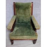 A late Victorian mahogany framed armchair in sage velour upholstery raised on turned tapering