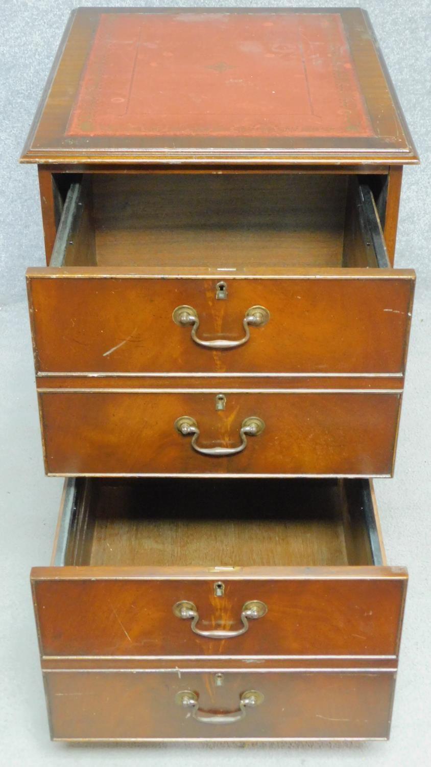 A Georgian style filing cabinet with inset tooled red leather top above two drawers on plinth - Image 3 of 4