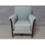 An Edwardian style mahogany framed Mollis armchair. H.80cm