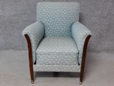 An Edwardian style mahogany framed Mollis armchair. H.80cm