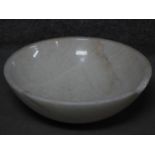 A carved circular polished white marble wash basin. H.15 W.43 D.43cm