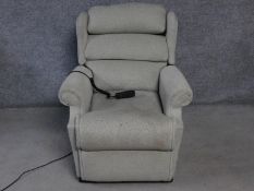 A Leggett & Platt reclining armchair with fully motorised back and footrest. H.105cm