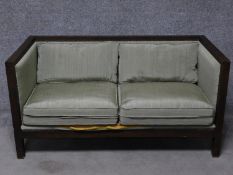 A contemporary framed two seater settee. H.71 W.142 D.71cm