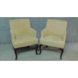 A pair of Georgian style cream upholstered armchairs on cabriole supports. H.82cm