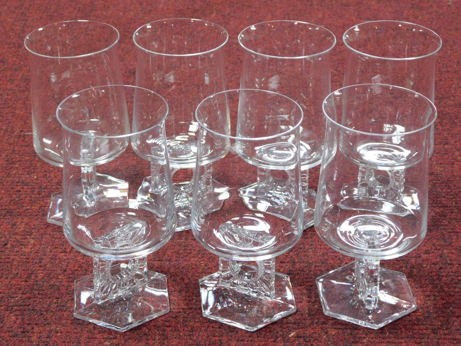 A set of seven Austrian mid century wine glasses with stylised floral design square stems with