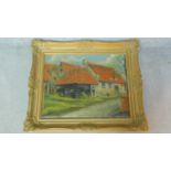 A gilt framed oil on canvas of a rural house, indistinctly signed. 54x64
