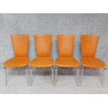A set of four contemporary tan leather dining chairs on chrome supports. H.94cm