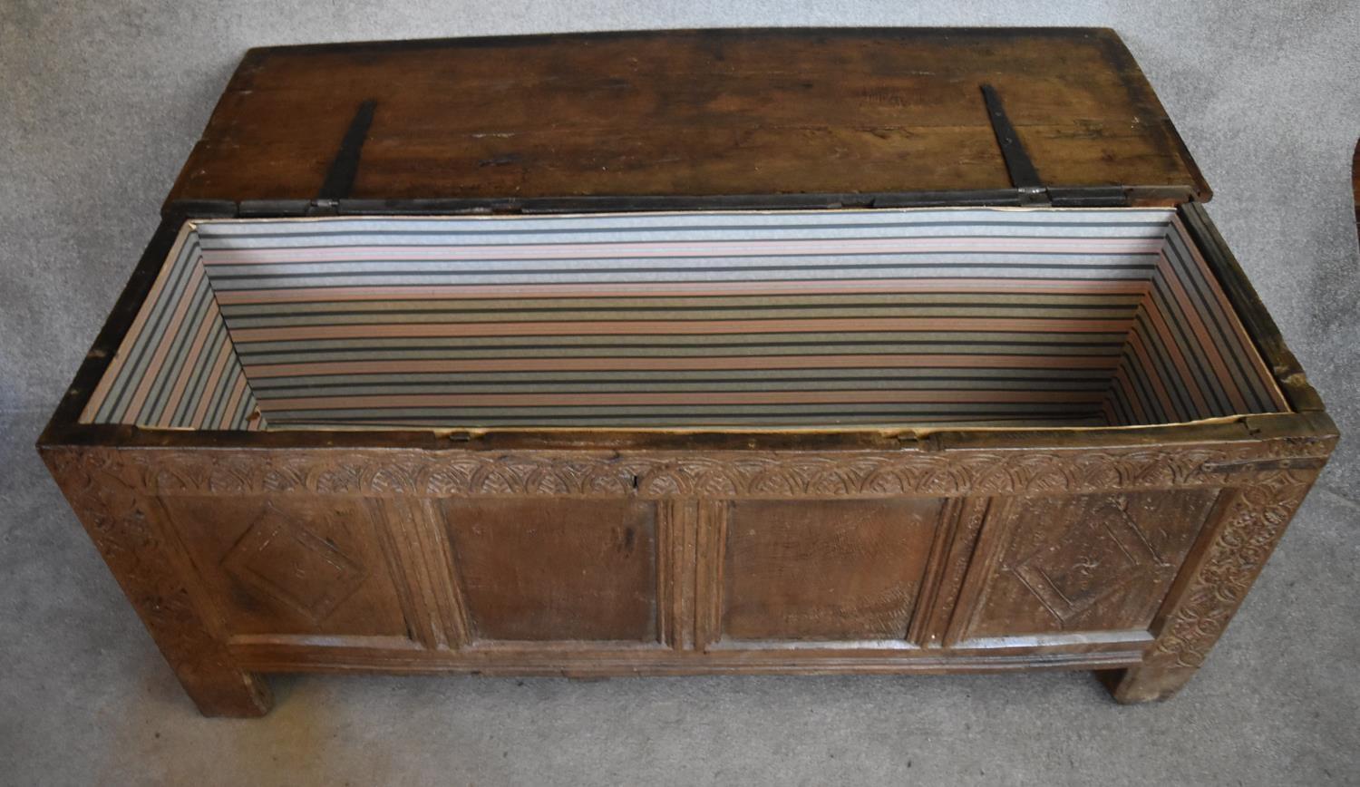 A 17th century carved oak coffer with hinged lidded top and panelled sides with lozenge decoration - Image 5 of 5