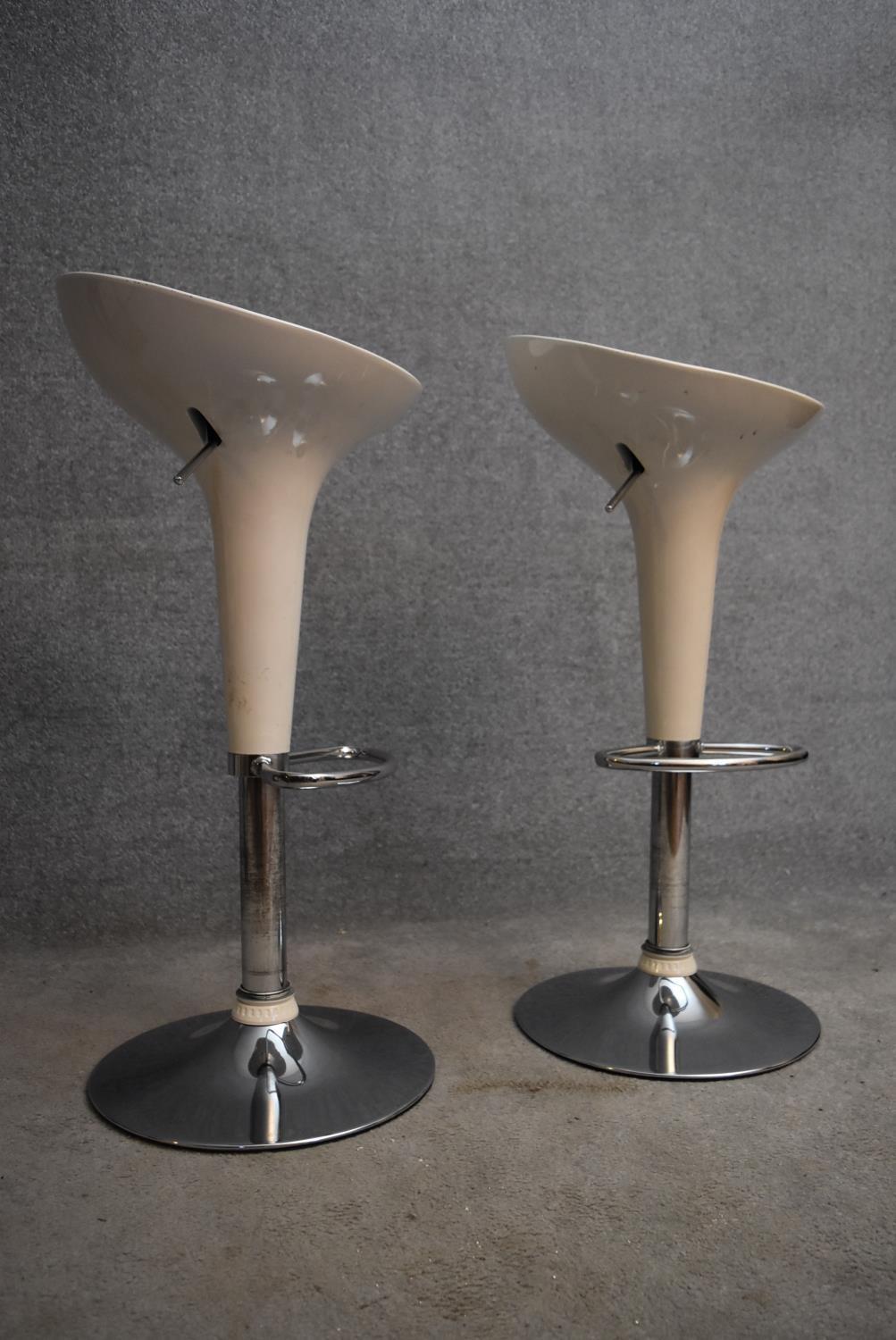 A pair of moulded adjustable high stools on chrome platform bases. H.85cm - Image 2 of 3