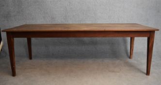 An antique style refectory dining table fitted with a frieze drawer to each end on square