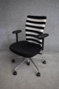 A Vitra adjustable swivel desk armchair. H.90cm