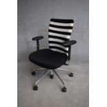 A Vitra adjustable swivel desk armchair. H.90cm